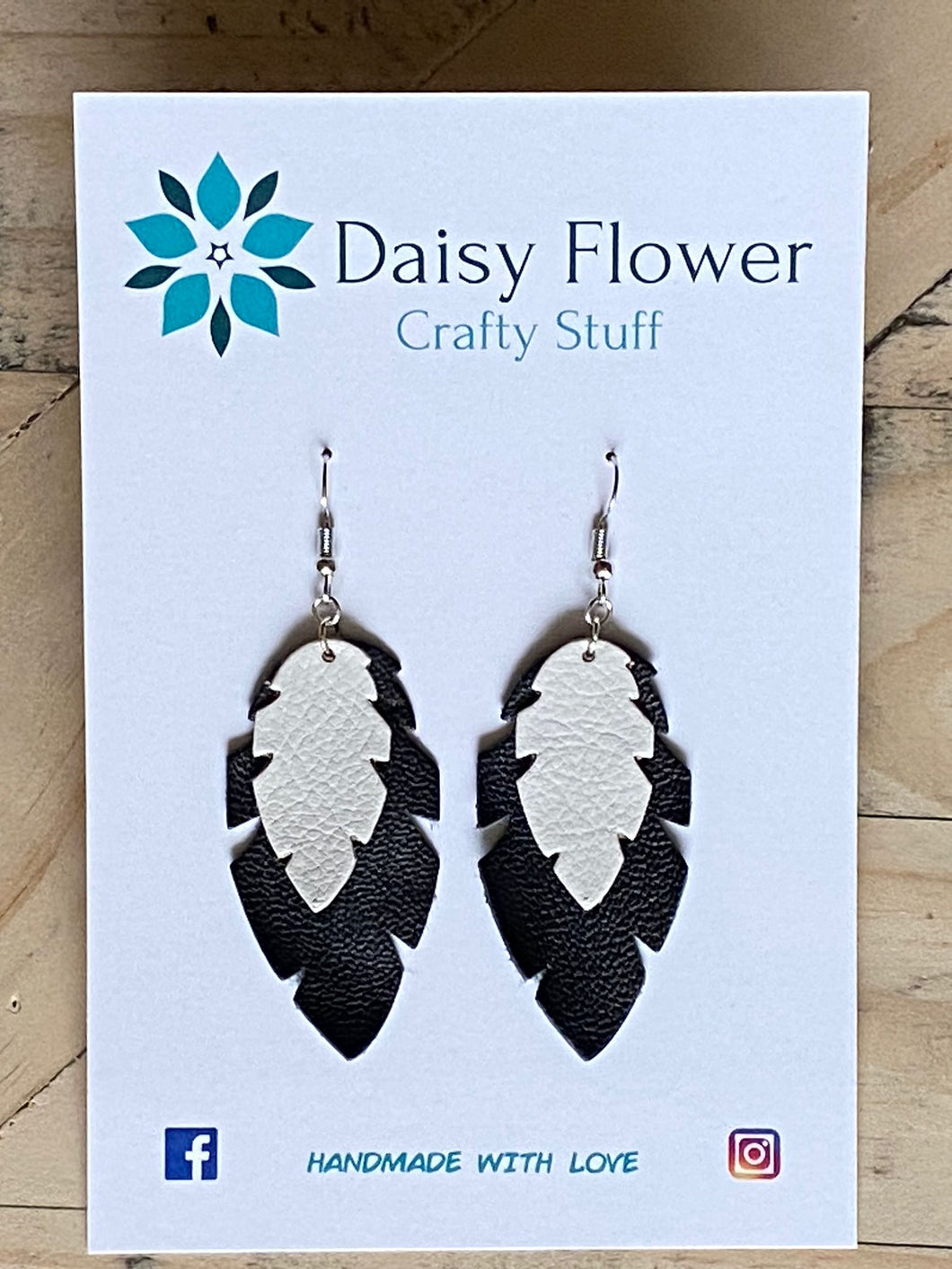 Leather black and white feather earrings